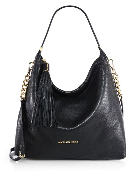 michael kors leather shoulder bag black|Michael Kors black studded bag.